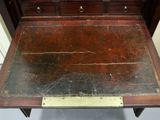 a wooden table with a metal plate on top of it