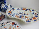 many plates and bowls that are on the table