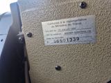 a label on the side of a machine that is sitting on a table