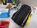a bicycle tire on a table next to a box of other items