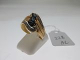 an image of a gold ring with a black stone in it
