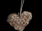 a heart hanging from a string on a black background