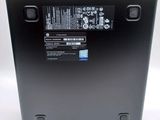 the back of a laptop with a battery on top of it