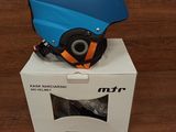 a blue helmet sitting on top of a box on a table