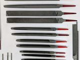 a lot of knives that are sitting on a table