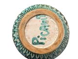 a picture of a green and white plate with a picture on it