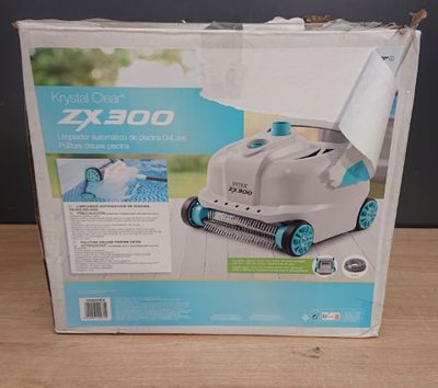 the box of the robotic pool cleaner is open and ready to be used