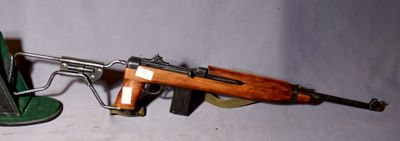 a toy gun and a lamp on a table