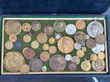 a box full of coins that are sitting on a table