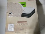 packaging of a mattress in a cardboard box on a table