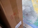 a box that is sitting on a pallet in a warehouse