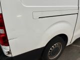 a white van that is parked in a parking lot