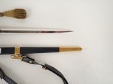three different types of knives on a white surface