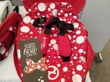 a baby car seat with a red polka dot design on it