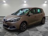 a brown car parked in a room with a checkered floor