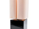 two black and white lamps sitting on top of a wooden block