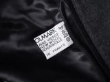 a close up of a black jacket with a label on it