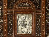 an intricately decorated book with a picture of a man and a woman