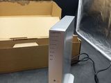 a wii remote sitting on a table next to a box