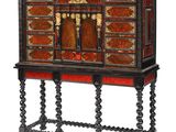 an old wooden cabinet with red and black paint on it