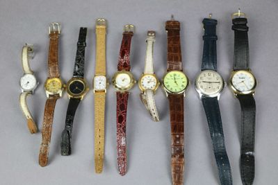 several different types of watches are lined up on a table