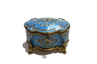 a blue and gold box sitting on a white surface