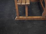 a wooden bench and a wooden table in a room