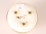 an image of a white plate with gold trim and a gold rim