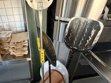 a lot of cooking utensils that are sitting on a stand