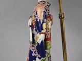 an image of a lamp with a woman in a kimono dress