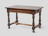 a small table with a wooden top and turned legs