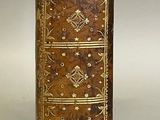an old book that is sitting on top of a table