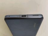 the back of a cell phone is shown with the camera on it ' s side