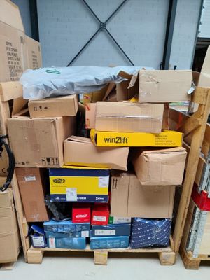 a pile of boxes sitting on a pallet in a warehouse