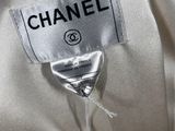 a close up of a chanel label on a dress