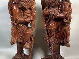 paire de figurines chinoises en bois sculpté représentant un homme et une femme