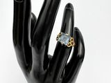 an image of a hand with a ring on it ' s finger