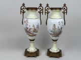 pair of antique vases with hand painted scenes on them