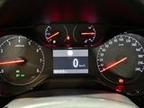 a close up of a car dashboard with various gauges