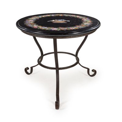 a black and gold table with a flower design on it
