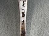a spoon that has some type of writing on it