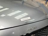 a car that has a sticker on the hood of it