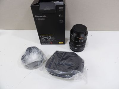 a box with a camera and a lens on a table