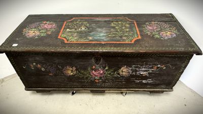 an old wooden box with a floral design on the lid