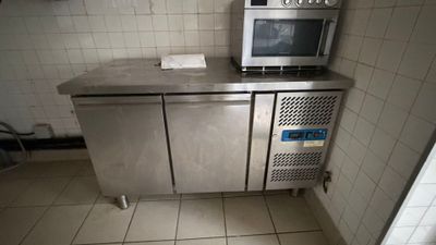 a microwave sitting on top of a counter in a kitchen