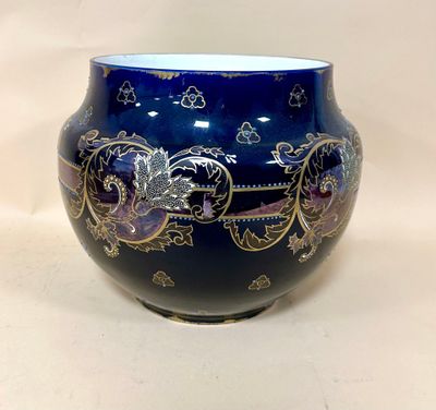 a blue vase with a gold and blue design on it