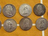 a close up of a bunch of coins sitting on a table