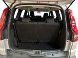 a trunk of a car with the back seats folded open