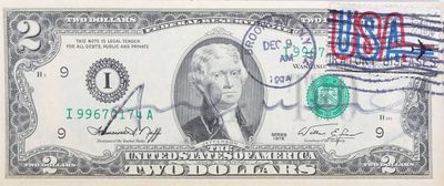 une photo d'un billet d'un dollar sur lequel est apposé un timbre