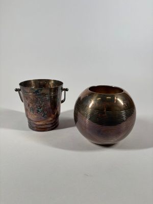 two vases sitting next to each other on a white surface